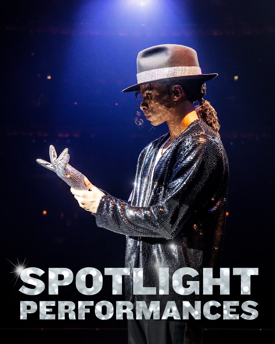 MJ Spotlight Performances - MJ putting on the glittery glove he is famous for wearing.